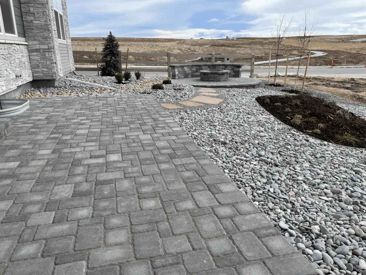 Omni Landscape and Sprinkler - Paver Patio with Rock Bed and Steppers
