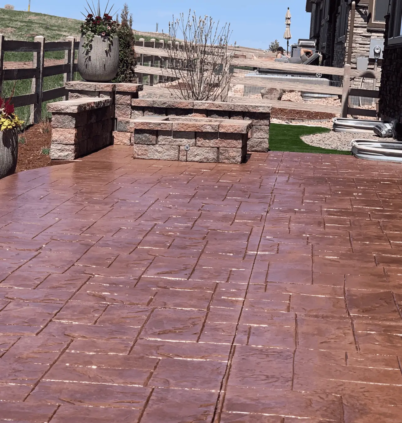 Omni Landscape and Sprinkler -Red Concrete Patio with Sitting wall Omni Landscape and Sprinkler -Red Concrete Patio with Sitting wall